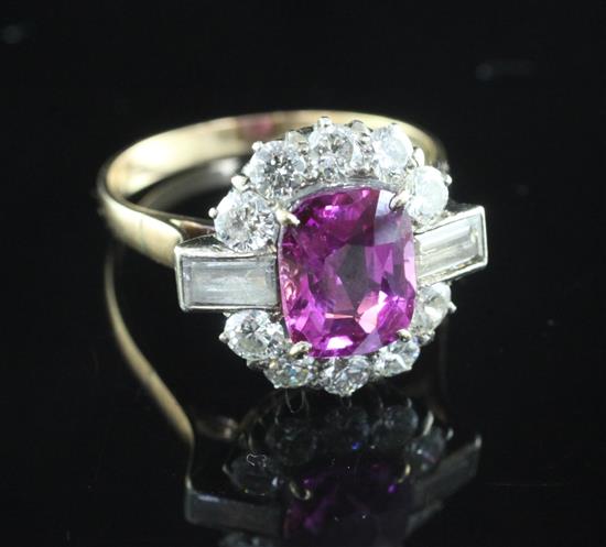 A 1940s/1950s 18ct gold, pink sapphire and diamond oval cluster ring, size O.